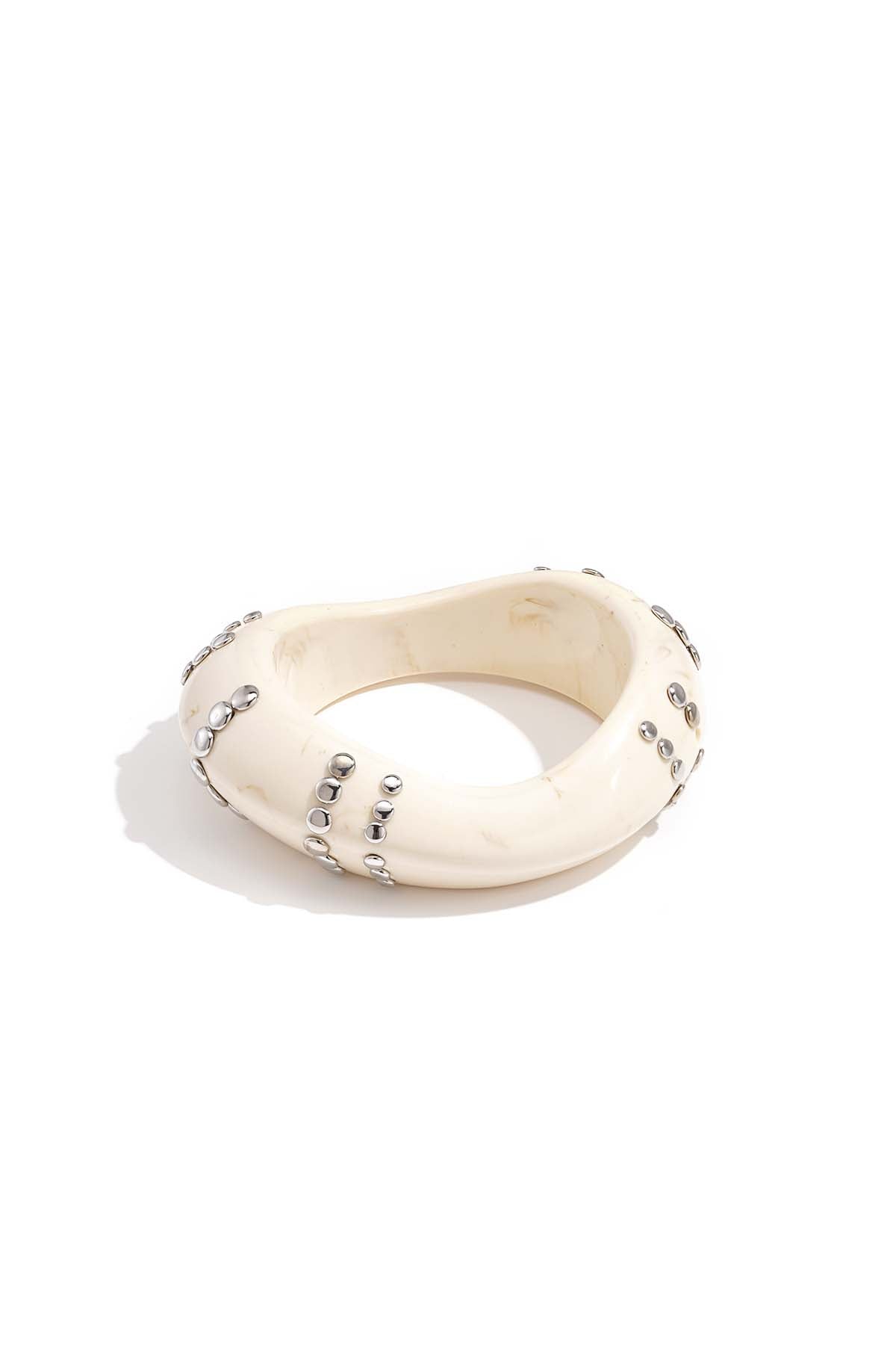 Resin bangle bracelet with studs in a striped pattern